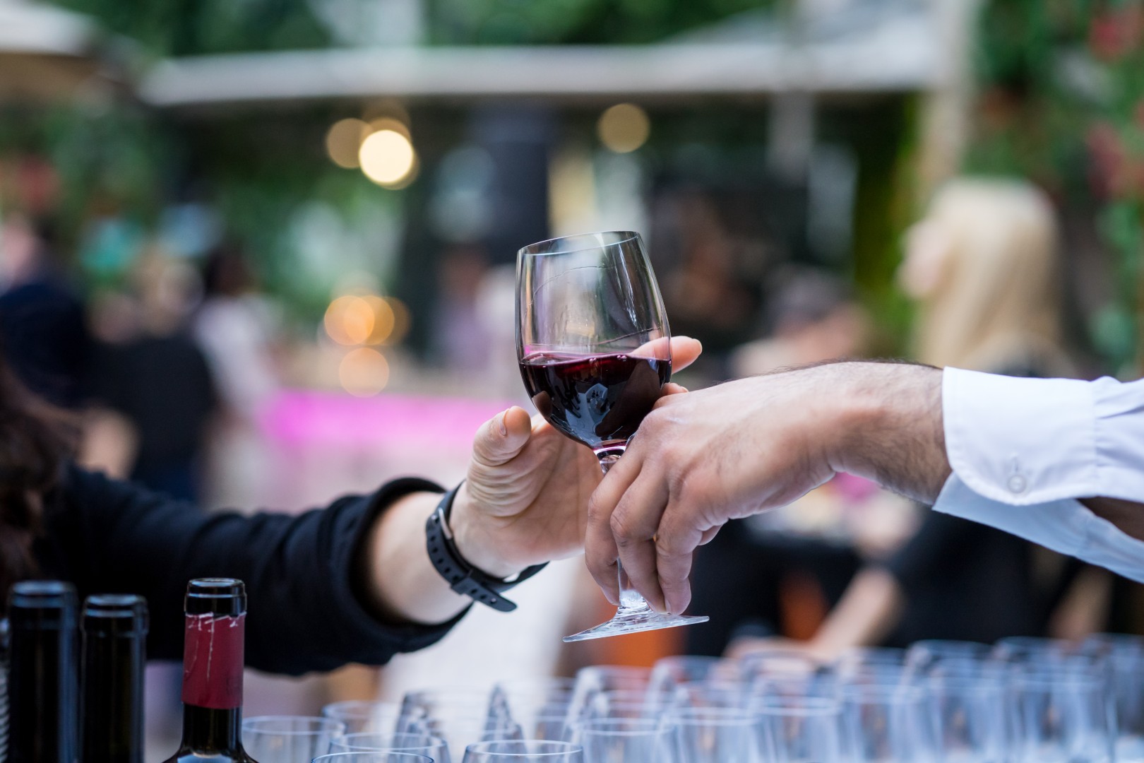 passing-a-glass-of-red-wine-at-event-2026-03-19-22-08-00-utc